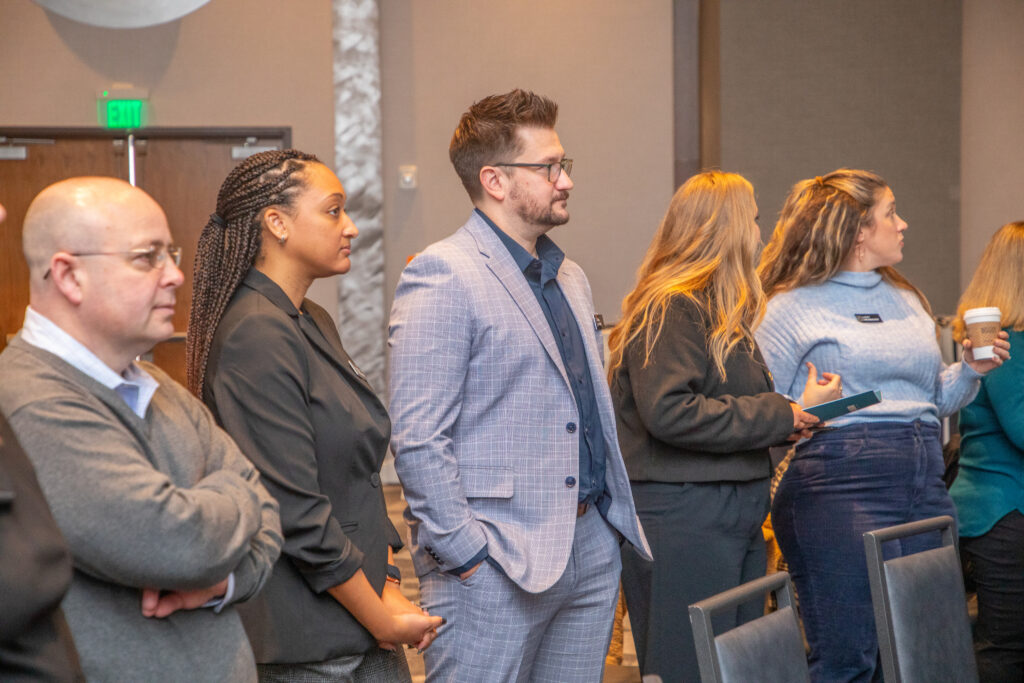 Young professionals of various ages at a networking event