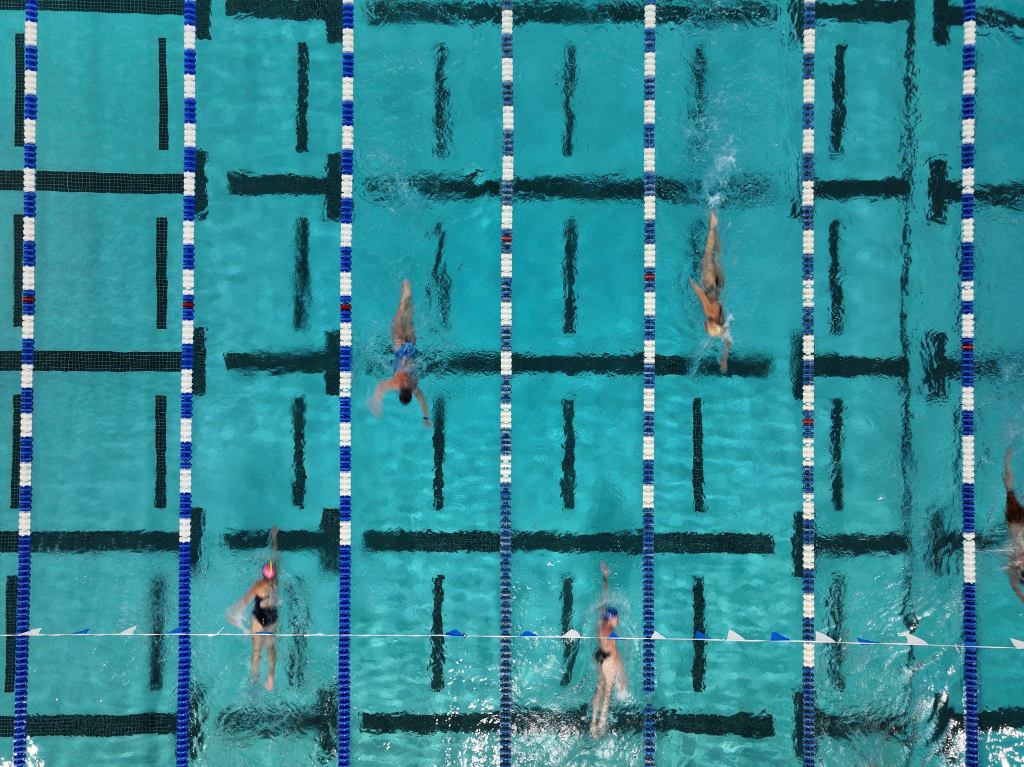 Aerial view of swimmers in lap lanes