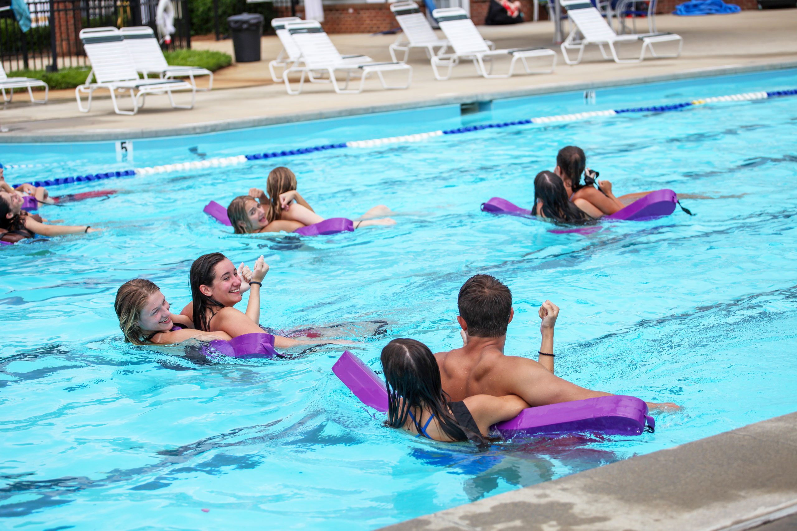 Lifeguards in training doing a pool exercise